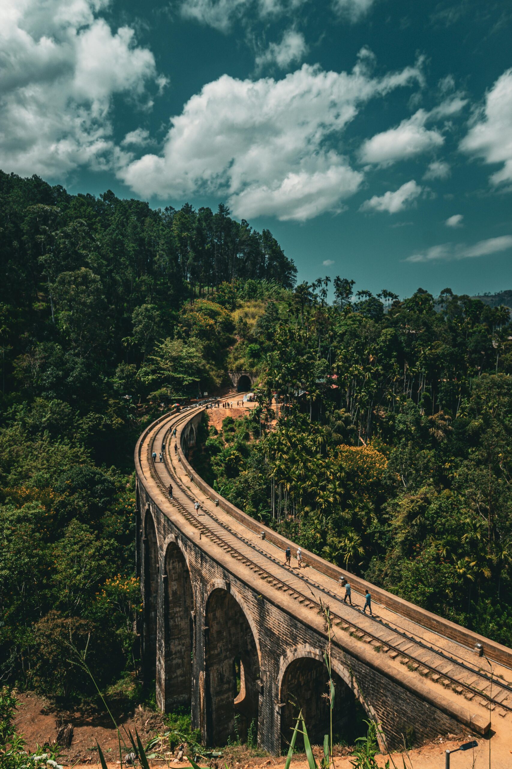 Lion Rock Ceylon Tours Ella adventure featuring Nine Arches Bridge, Ella Rock, and Ravana Falls in Sri Lanka.
